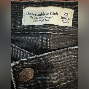 Abercrombie 90s slim straight high rise black jeans with crossover waistband.